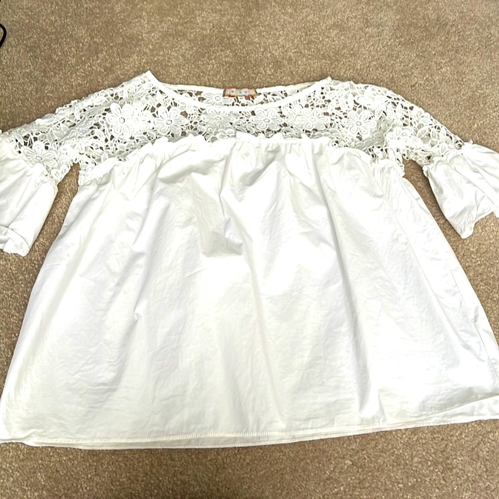 White top with crochet lace top and bell sleeves. Size xs